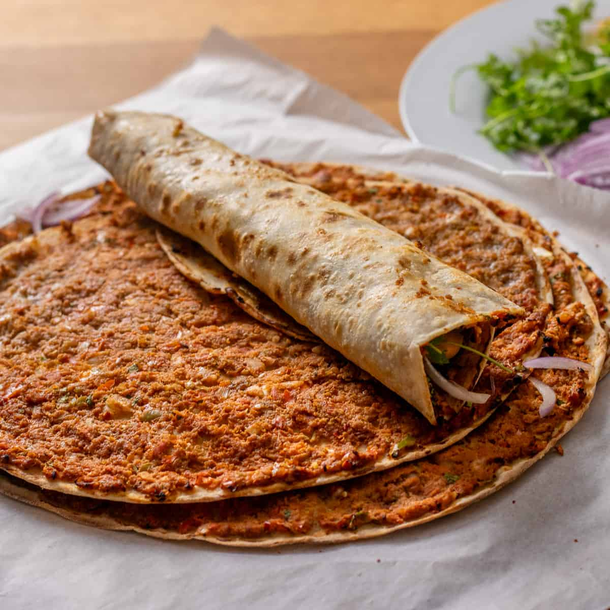 Crispy Lahmacun, Turkish-style pizza topped with spiced minced meat and herbs