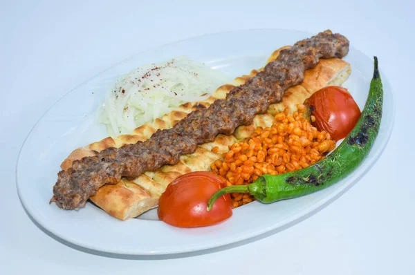 Authentic Urfa kebab, a milder alternative, prepared with fresh herbs and spices